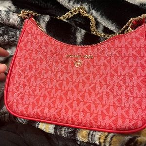 Mickael Kors red purse.